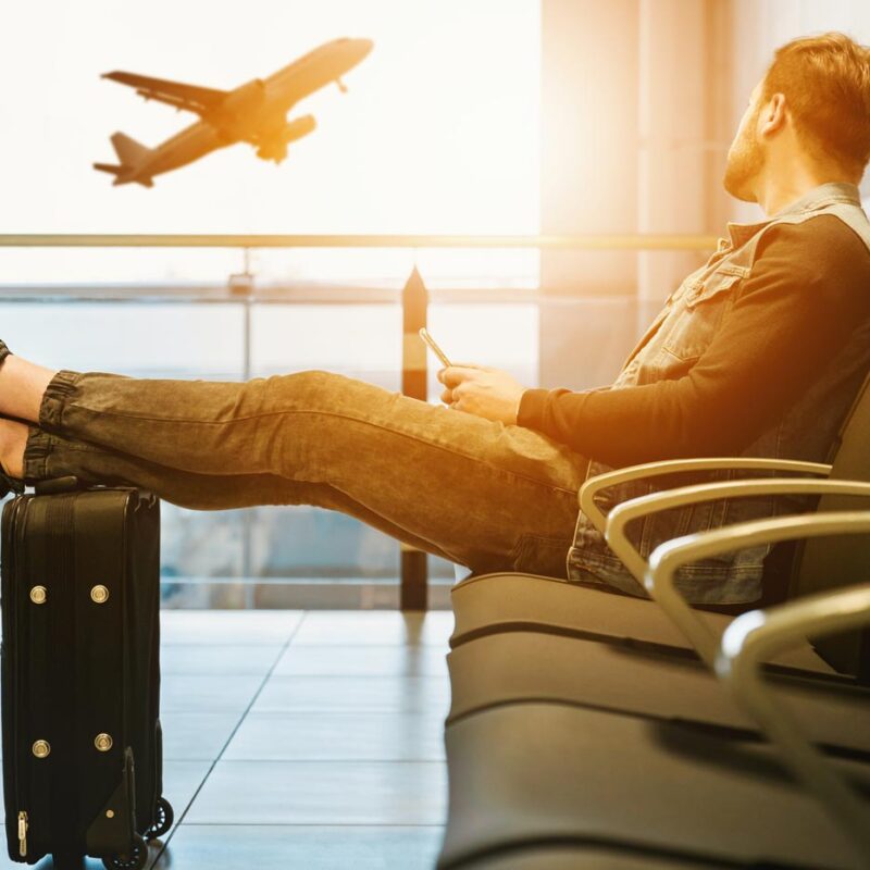 Man in airport discussing if its legal to travel with cannabis